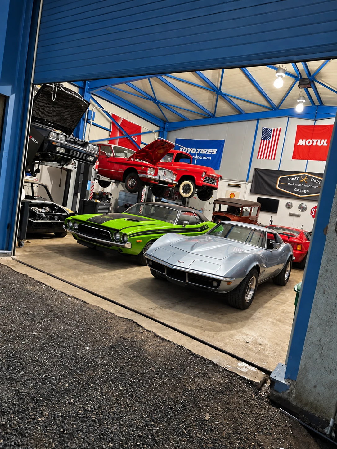 Classic American cars at the entrance to Rusty Gold Garage