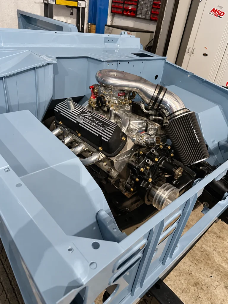 Ford Bronco V8 installed in a freshly painted engine bay
